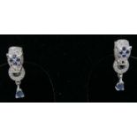 A pair of sterling silver panther-head earrings, pave-set with sapphires and white crystals (in