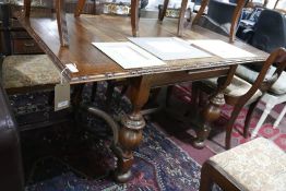 WITHDRAWN-An early 20th century oak draw leaf table, raised on turned baluster supports and bun