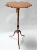 A 19th century satinwood hexagonal lamp table, with ebony inlay raised on tripod base, H.73cm