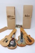 Two Beatles watches in guitar shaped cases