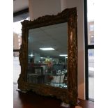 A Rococo style gilt framed wall mirror, H.100 W.82cm