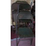 Five vintage steel folding chairs
