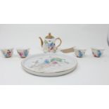A 20th century Chinese porcelain tea set with erotic decoration