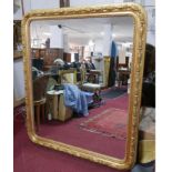 A large early 20th century French gilt wood mirror, with moulded holly leaf frame and egg and dart