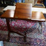 A 19th century mahogany reading/music stand, raised on castors, H.80 W.84 D.38cm