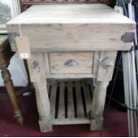 A contemporary butchers block, with single drawer, on turned supports, with bottle opener and