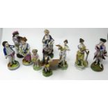 A collection of nine 19th century porcelain figures, to include a Crown Derby example and two