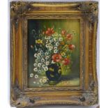 An oil on panel of a still life of flowers, in gilt frame, 24 x 19cm