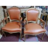 A pair of Louis XV style fauteuils, with orange leatherette seats, on cabriole legs (2)