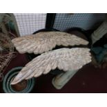 A pair of carved distressed painted wooden angel wings, L.99cm