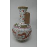 An early 20th century Chinese porcelain vase, decorated with two dragons chasing flaming pearl,