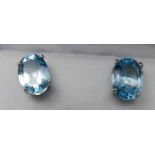 A boxed pair of sterling silver and oval blue topaz stud earrings, 8 x 6mm, 1.6g.