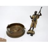 A brass trench art ash tray made from artillery casing, together with a Bergman style spelter figure