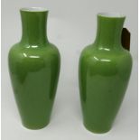A pair of 20th century Chinese green crackle glazed porcelain vases, with six character marks to