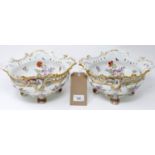 A pair of 19th century hand painted Continental porcelain bowls, with floral decoration, one has a
