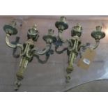 A pair of 19th century ormolu two branch wall sconces, later drilled for wiring, with urn finials
