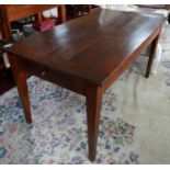 A late 19th/early 20th century cherry wood dining table, single end drawer and one side drawer,