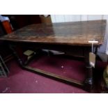 A late 18th/early 19th century oak centre table, with single end drawer, raised on turned legs