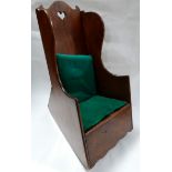 A late 19th century mahogany child's rocking chair/commode, the shaped backrest with pierced heart