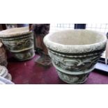 Two reconstituted stone planters, decorated with masks, scrolling foliage and palmettes, H.49cm