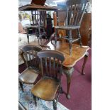 A set of four oak country house dining chairs