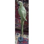 A resin parrot on a floor standing perch, H.121cm