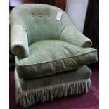An armchair upholstered by Sinclair Melson Ltd By Appointment To The Queen