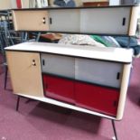 A 1950's Formica sideboard with perspex sliding doors, H.119 W.122 D.41cm
