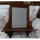 An Edwardian mahogany mirror with shelf and bevelled plate, H.67 W.60 D.15cm