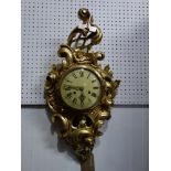 A Dutch gilt wood Cartel style wall clock, the round convex dial with Roman and Arabic numerals, the