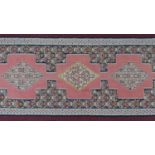 A North West Persian Senneh runner kilim, repeating stylised diamond medallion with repeating