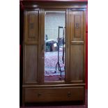 An Edwardian mahogany wardrobe, with fitted mirror door and drawer to base. H.201 W.132 D.57cm