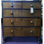 An early 19th century mahogany chest, two short over three long drawers, raised on turned feet, H.