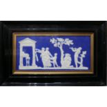 A Jasperware plaster plaque of Classical figures offering libations, signed W. Wood, framed and