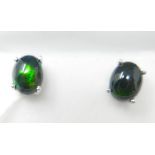 A boxed pair of sterling silver, black opal cabochon stud earrings (flashes of green, blue and red),