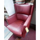 A Kinnarps read leather swivel chair