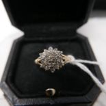 An antique 19ct yellow gold and diamond cluster ring set with 20 brilliant-cut diamonds to carved