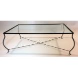 A wrought iron and glass top coffee table, bought from Heals