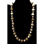 A boxed carved green jade and freshwater pearl necklace, L: 48cm