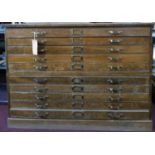 An early 20th century oak plan chest of 10 drawers, H.90 W.124 D.91cm