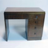 A 20th century teak desk with 5 drawers, raised on plinth base, H.77 W.93 D.52cm