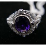 A sterling silver oval amethyst and white sapphire cluster ring, Size: N, 3g