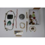 An assortment of vintage costume jewellery to include a rolled gold propelling pencil, an antique