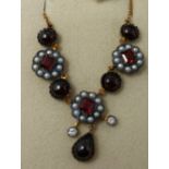 A boxed yellow gold, diamond, seed pearl and garnet cluster necklace, L: 48cm, 6.7g