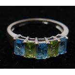 A 9ct white gold five stone ring, set with cushion cut aquamarine and green gemstones