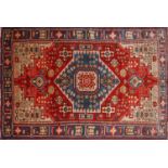 A North West Persian Nahawand rug, central diamond medallion with repeating petal motifs on a