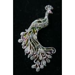 A sterling silver, marcasite and plique-à-jour enamel peacock brooch (hues of green, yellow and