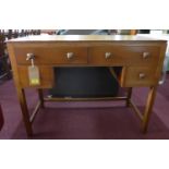 A Waring & Gillow oak desk with four drawers, H.76 W.99 D.45cm