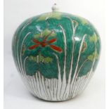 An early 19th century Chinese famille verte Chinoiserie ginger jar with lotus flower and butterfly
