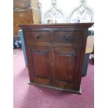 A 19th century miniature oak standing / hanging cabinet, two drawers over two shelves with doors, 55